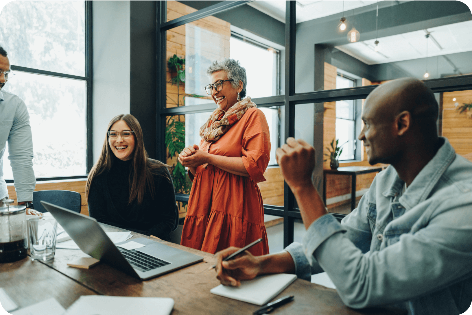 A group of colleagues collaborate in a meeting